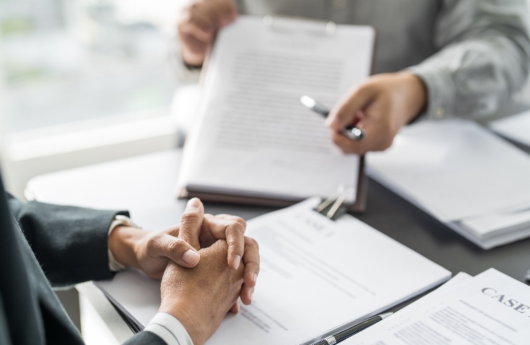 lawyer is reviewing documents with the client_s